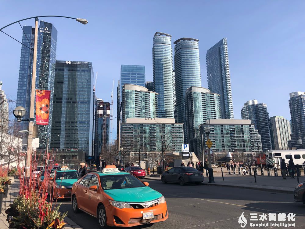 orange car on road near city buildings during_yythk.jpg